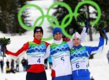 WHISTLER, BC - FEBRUARY 14: (L-R) Johnny Spillane (silver) of United States, Jason Lamy Chappuis (gold) of France and Alessandro Pittin (bronze) of Italy pose during the flower ceremony following the Nordic Combined Men's Individual 10km on day 3 of the 2010 Winter Olympics at Whistler Olympic Park Cross-Country Stadium on February 14, 2010 in Whistler, Canada. (Photo by Lars Baron/Getty Images)